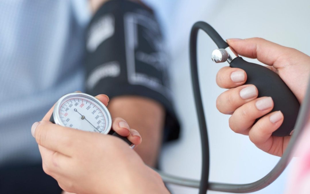 doctor taking blood pressure reading