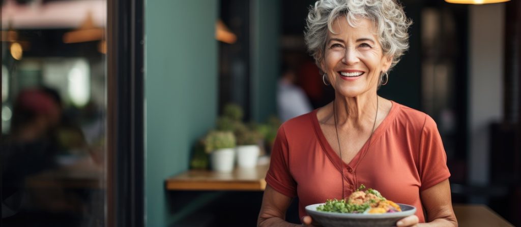 Elderly woman enjoying vegan meal at home caring for her body