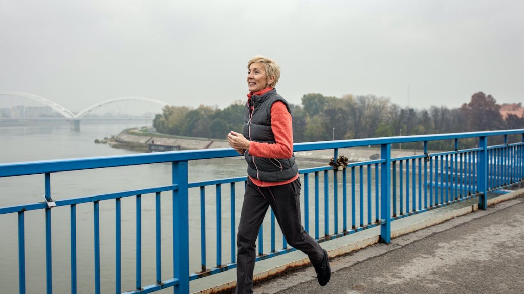 Woman jogging outside in cold weather